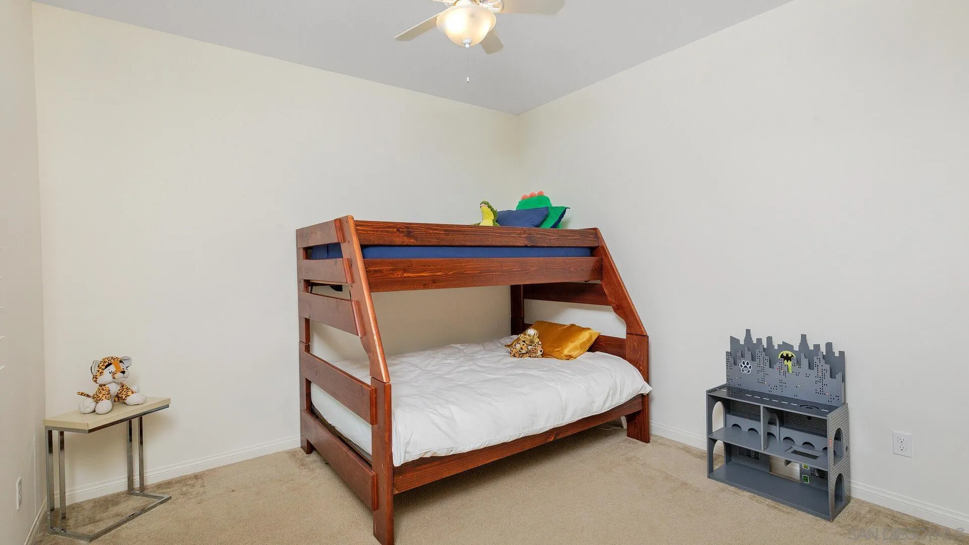 15575 Tanner Ridge Road San Diego, CA 92127 - Photo 26 of 41 a bedroom with a bed and a chandelier fan