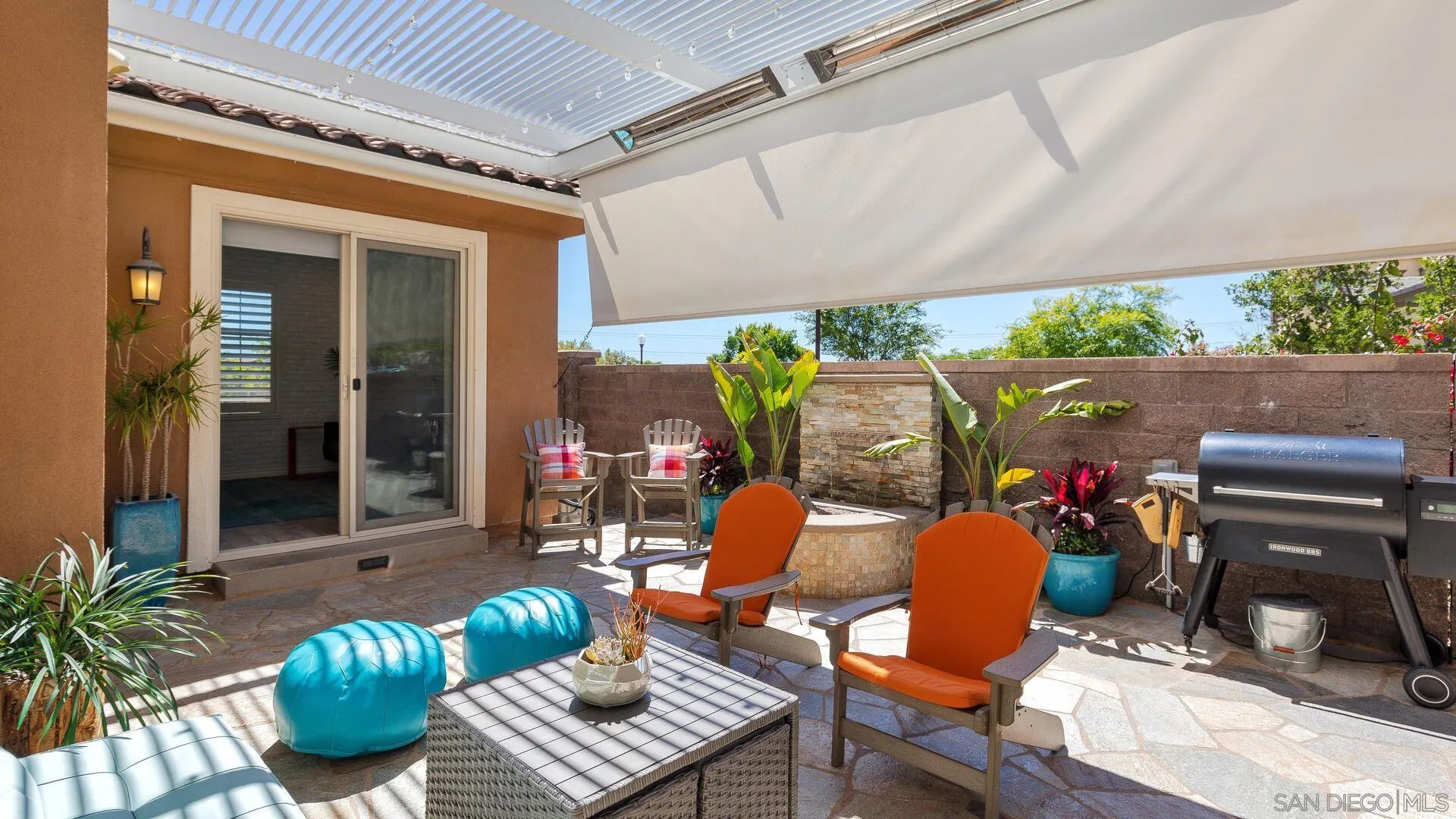 15575 Tanner Ridge Road San Diego, CA 92127 - Photo 34 of 41 a outdoor living space with furniture and a fireplace
