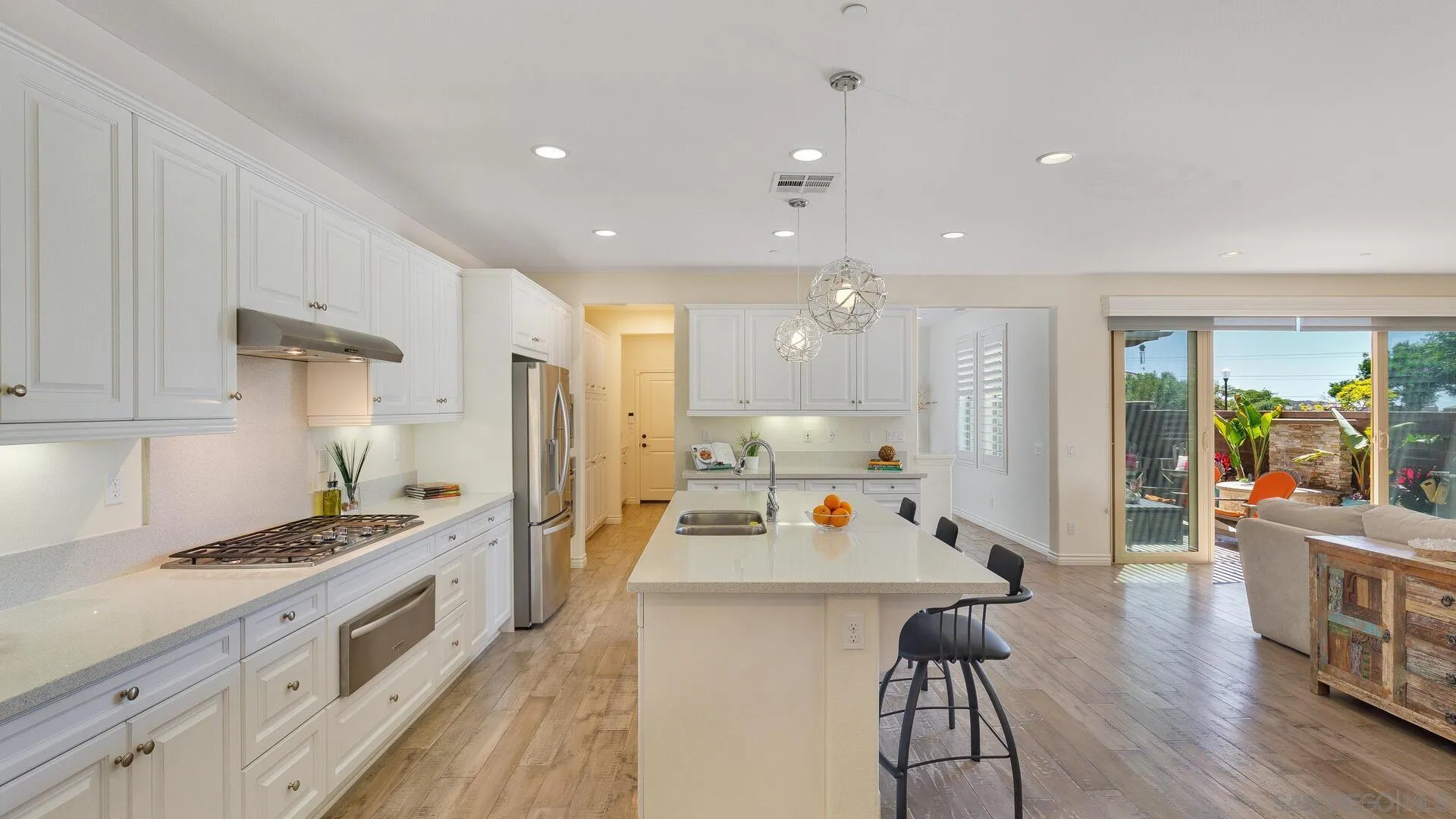 15575 Tanner Ridge Road San Diego, CA 92127 - Photo 4 of 41 a large kitchen with a table and chairs