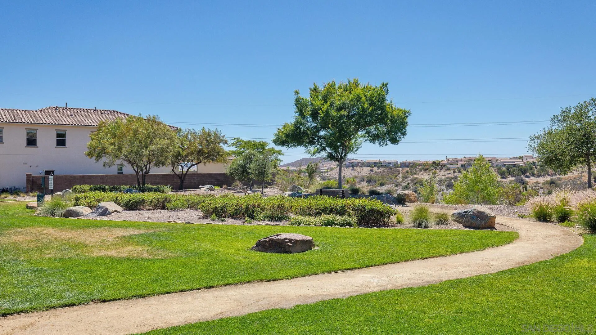 15575 Tanner Ridge Road San Diego, CA 92127 - Photo 41 of 41 a view of a garden with a building in the background