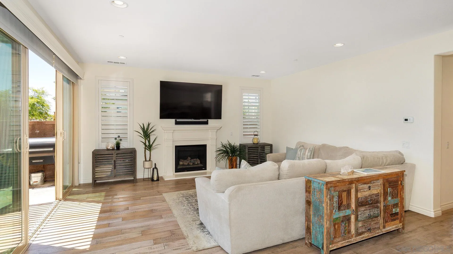 15575 Tanner Ridge Road San Diego, CA 92127 - Photo 6 of 41 a living room with furniture and a flat screen tv