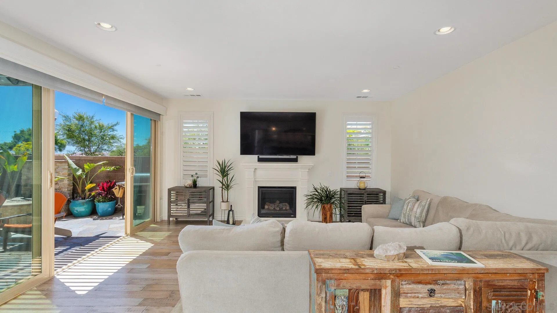 15575 Tanner Ridge Road San Diego, CA 92127 - Photo 7 of 41 a living room with fireplace furniture and a flat screen tv