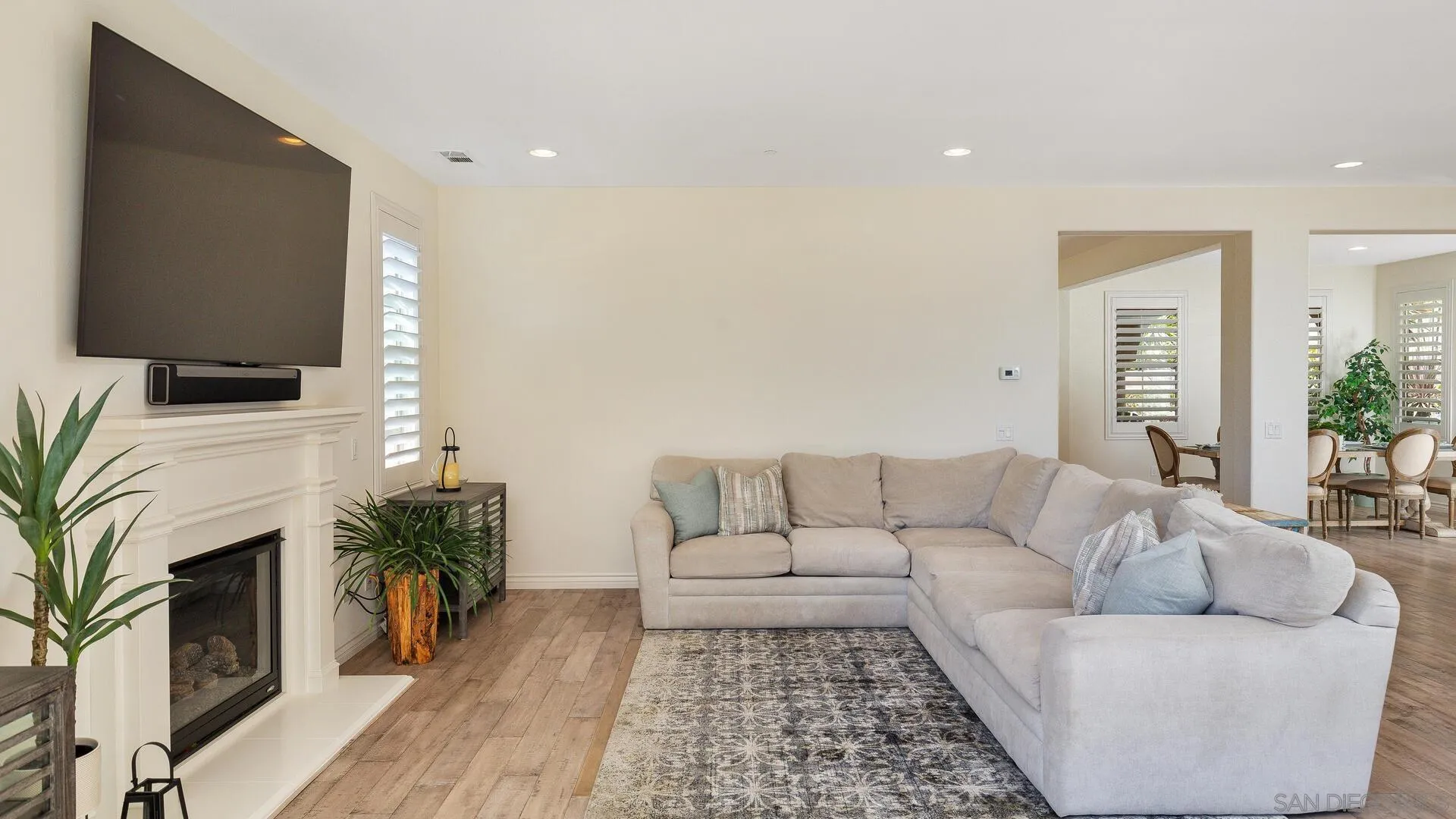15575 Tanner Ridge Road San Diego, CA 92127 - Photo 9 of 41 a living room with furniture fireplace and potted plant