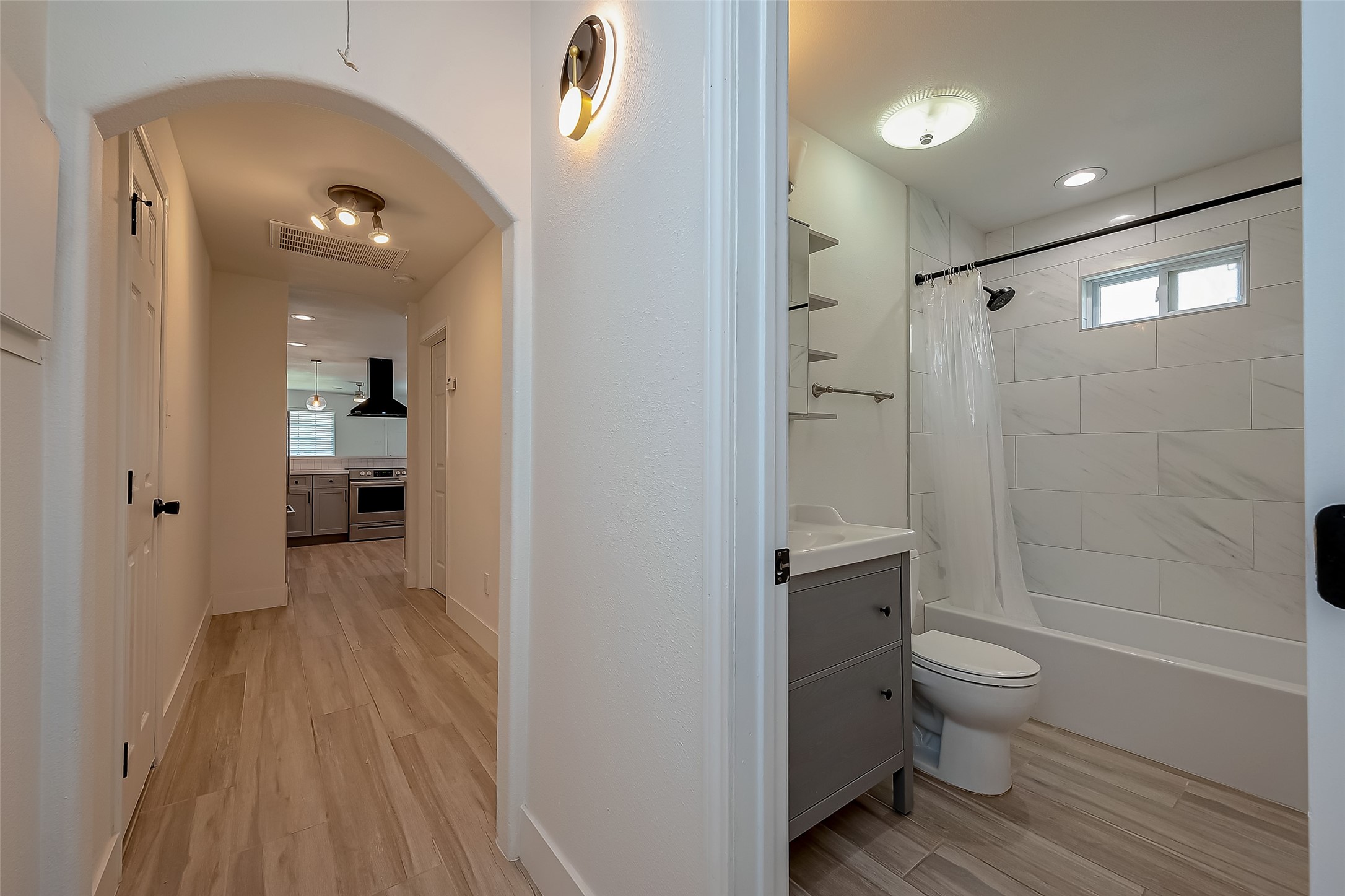 915 Adele Street Houston, TX 77009 - Photo 13 of 23 a bathroom with a sink and toilet