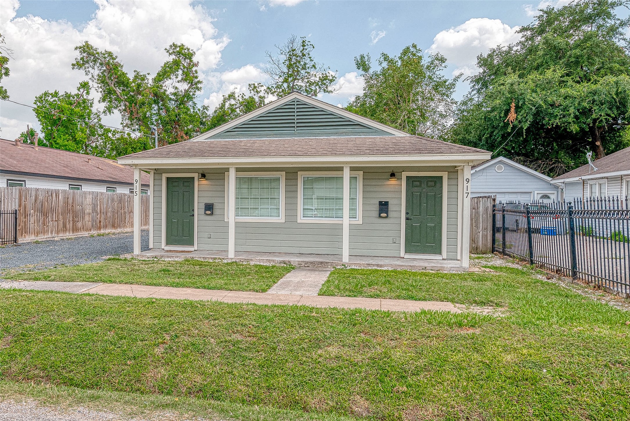 915 Adele Street Houston, TX 77009 - Photo 2 of 23 a front view of a house with a garden