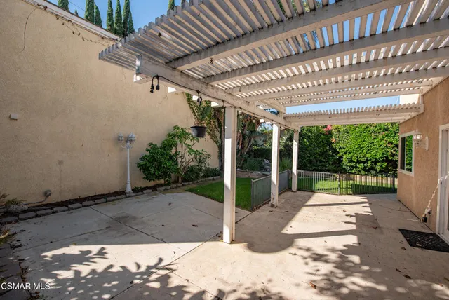 a view of a porch and garden
