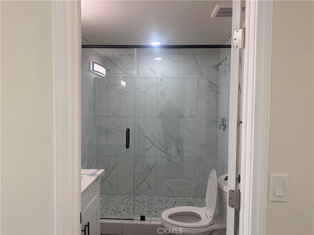 10337 Mull Avenue Riverside, CA 92505 - Photo 10 of 28 a bathroom with a shower