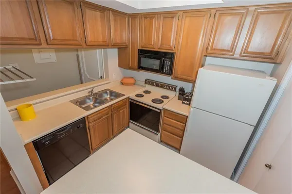 a kitchen with a stove microwave and refrigerator