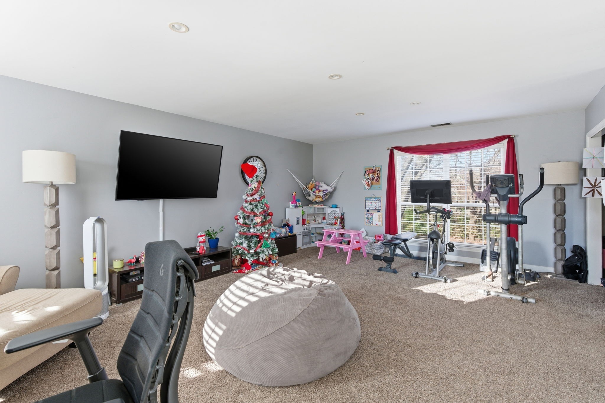 1766 Witt Way Drive Spring Hill, TN 37174 - Photo 16 of 36 a living room with furniture and a flat screen tv