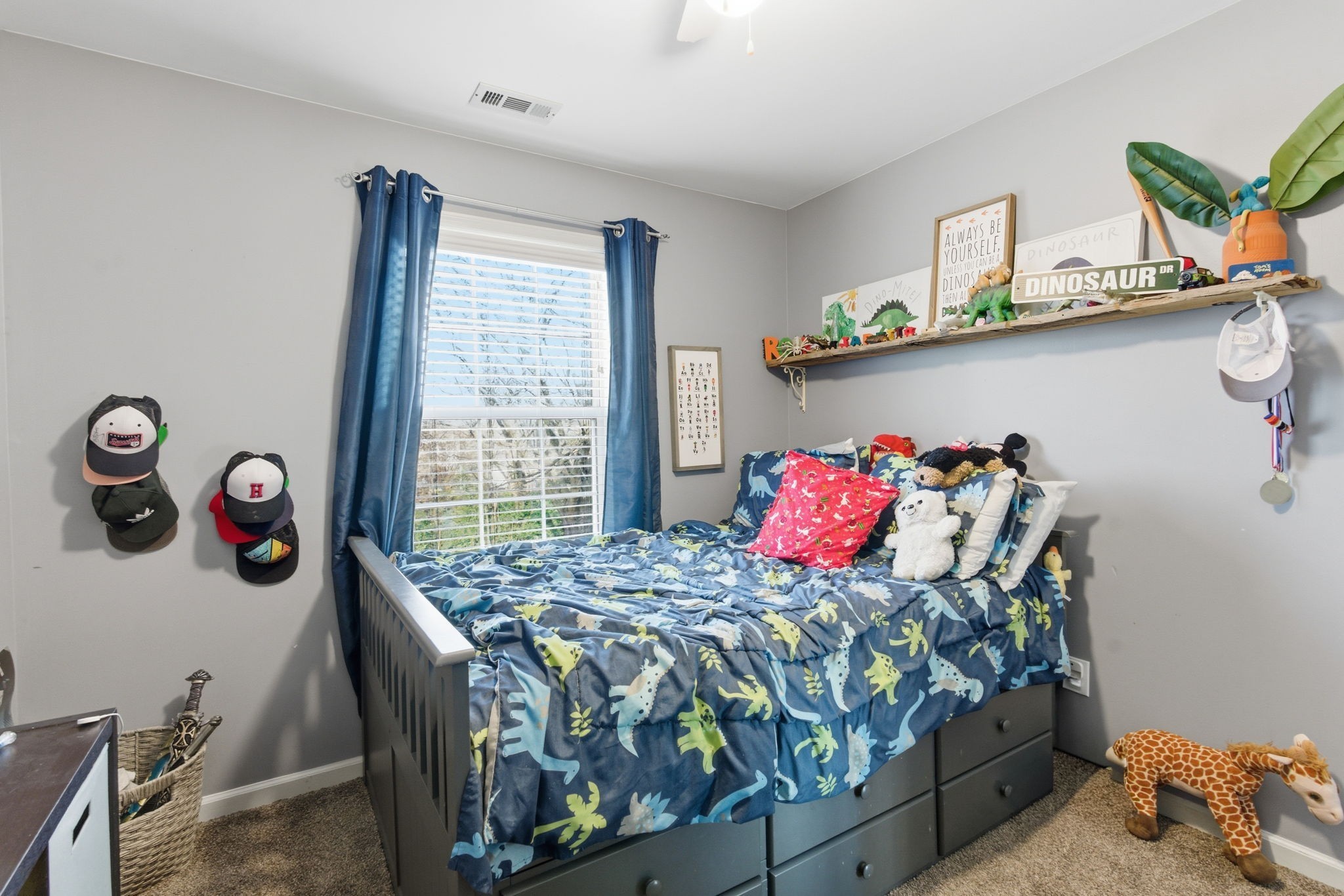 1766 Witt Way Drive Spring Hill, TN 37174 - Photo 21 of 36 a bedroom with a bed and a table in it