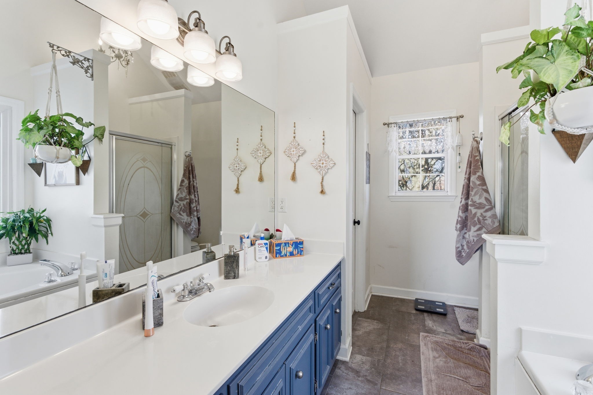 1766 Witt Way Drive Spring Hill, TN 37174 - Photo 27 of 36 a bathroom with a sink double vanity mirror and a shower