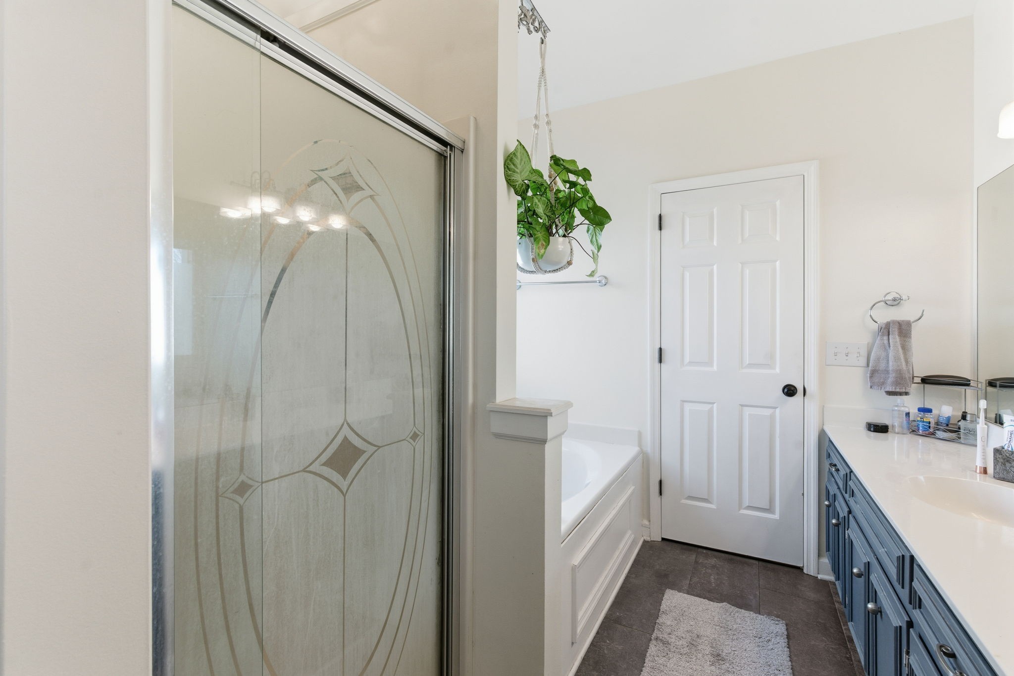 1766 Witt Way Drive Spring Hill, TN 37174 - Photo 29 of 36 a bathroom with a bathtub and shower