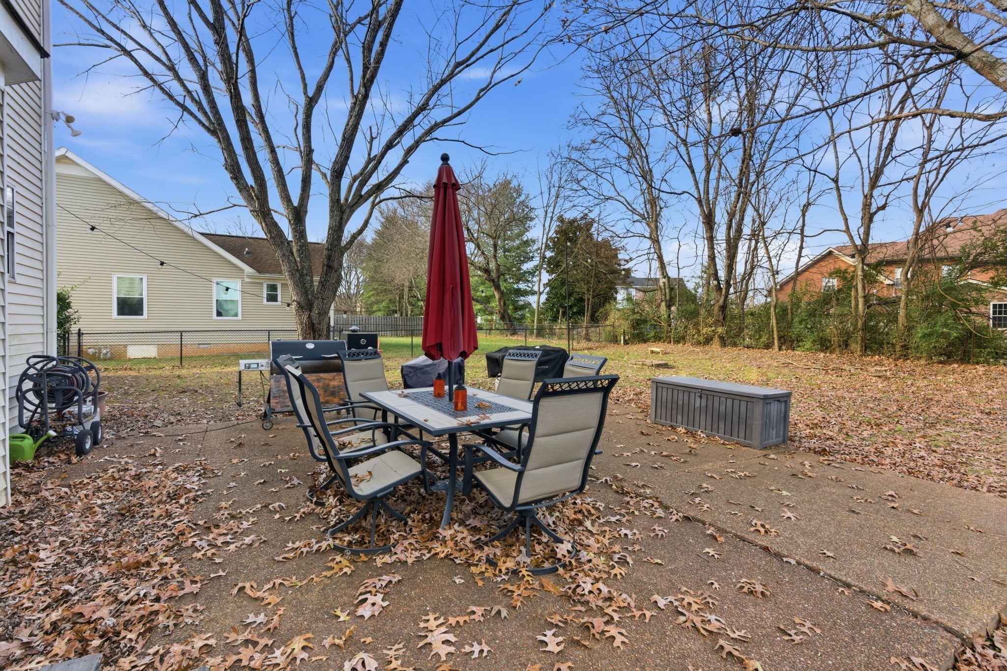 1766 Witt Way Drive Spring Hill, TN 37174 - Photo 32 of 36 a view of a backyard with table and chairs and a fire pit