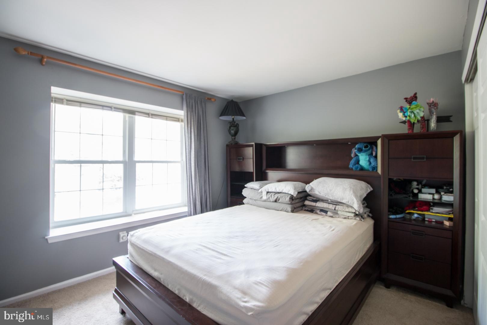 15 B Andover Circle, Unit B Princeton, NJ 08540 - Photo 11 of 14 a bedroom with a bed and window