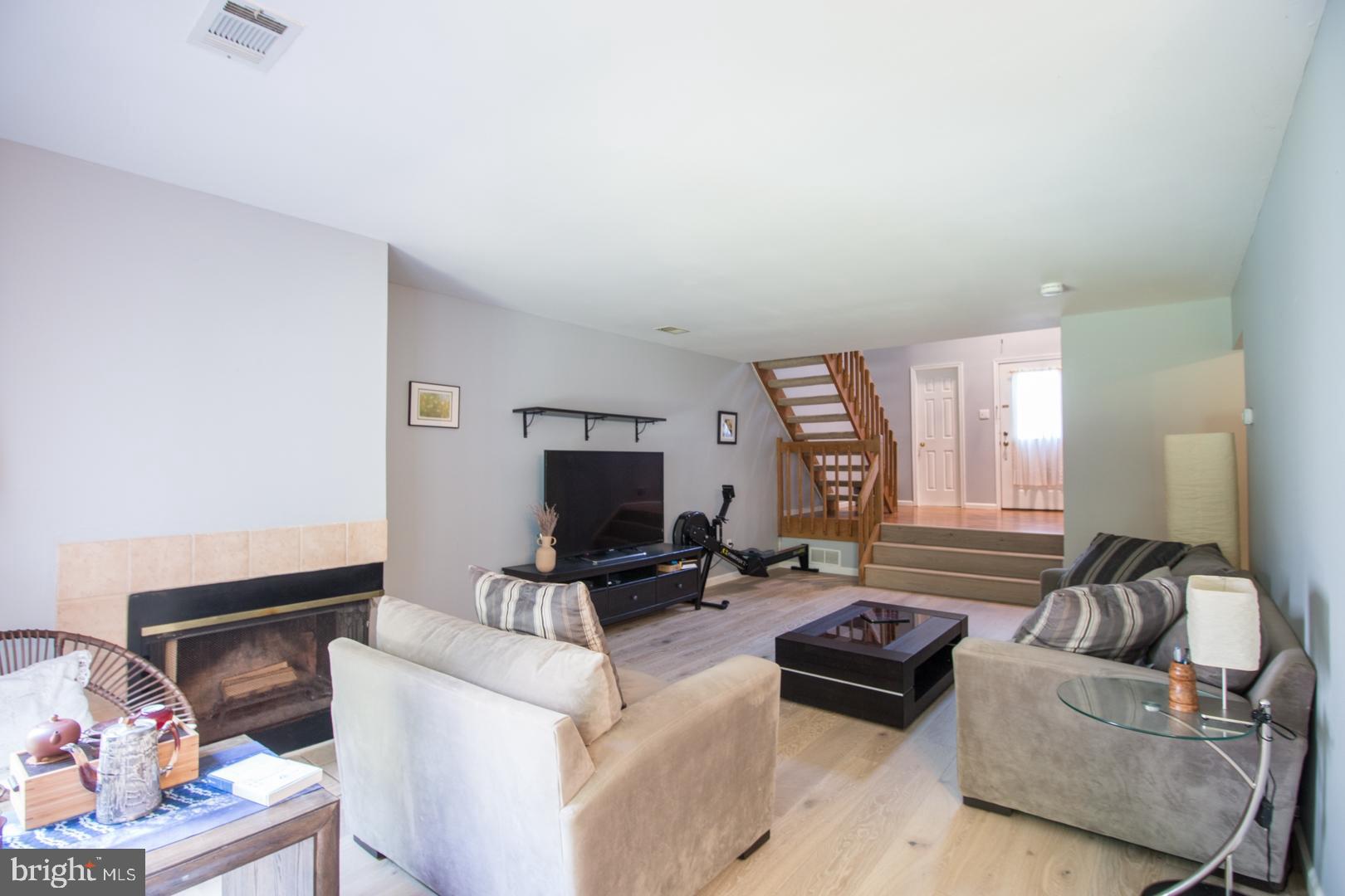 15 B Andover Circle, Unit B Princeton, NJ 08540 - Photo 3 of 14 a living room with furniture and a flat screen tv