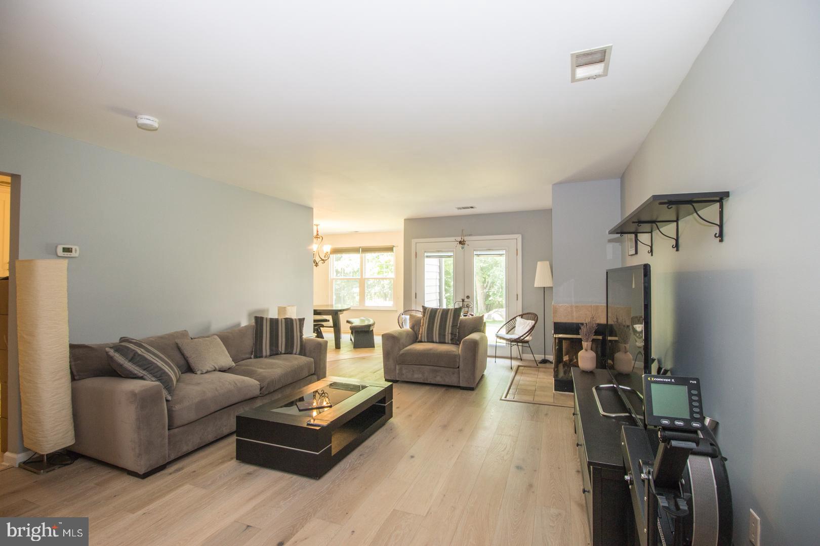 15 B Andover Circle, Unit B Princeton, NJ 08540 - Photo 4 of 14 a living room with furniture and a flat screen tv