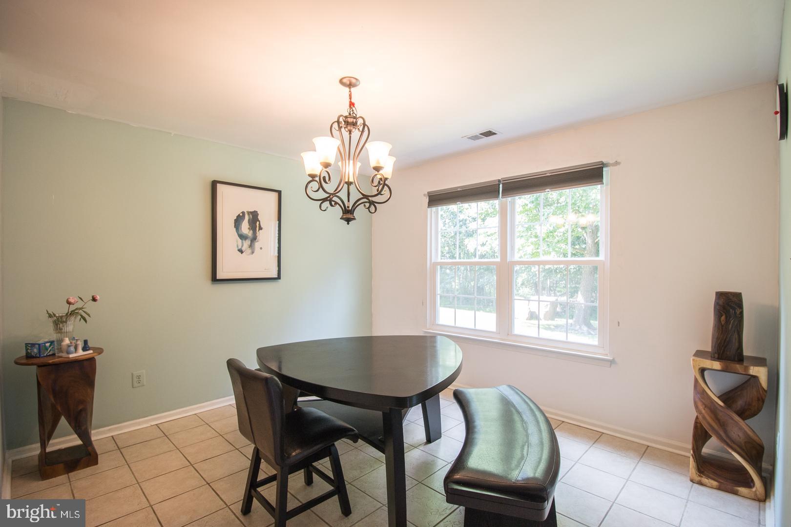15 B Andover Circle, Unit B Princeton, NJ 08540 - Photo 6 of 14 a view of a dining room with furniture and chandelier