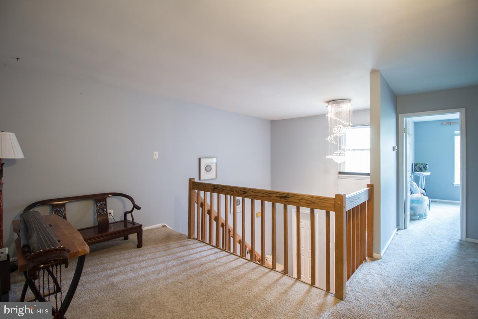 15 B Andover Circle, Unit B Princeton, NJ 08540 - Photo 7 of 14 a view of a bedroom with furniture and staircase