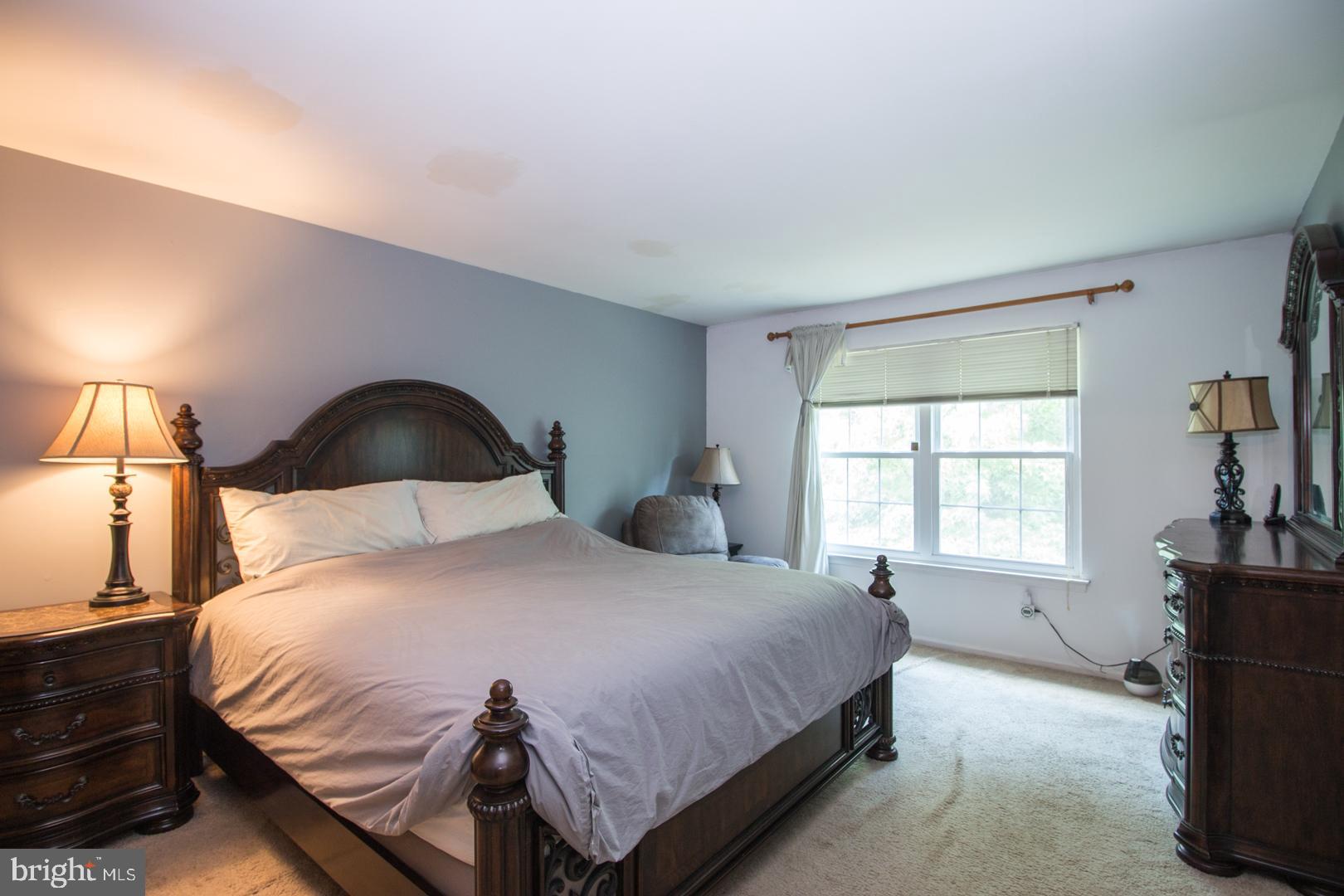 15 B Andover Circle, Unit B Princeton, NJ 08540 - Photo 9 of 14 a bedroom with a bed and a window