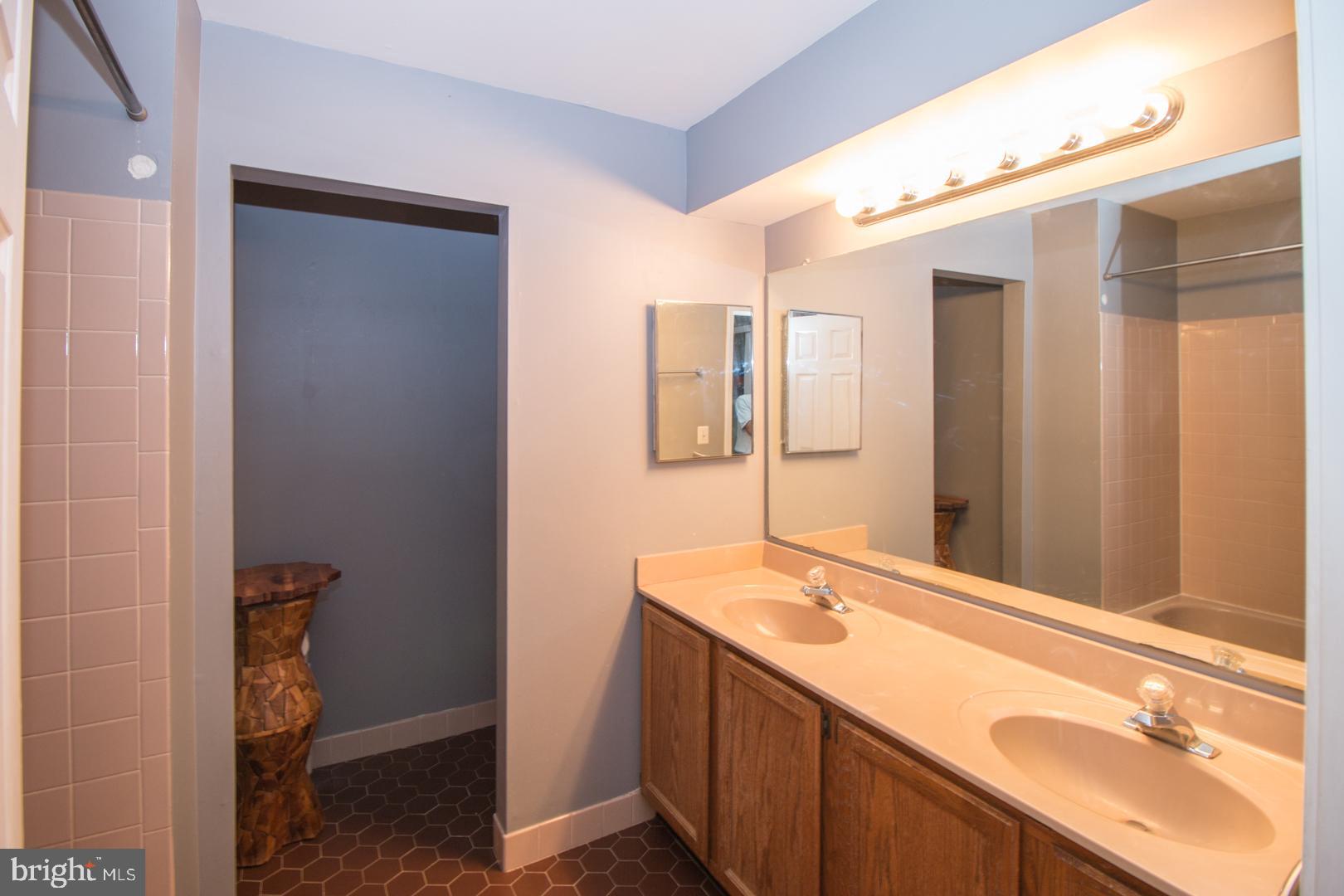 15 B Andover Circle, Unit B Princeton, NJ 08540 - Photo 10 of 14 a bathroom with a sink and a mirror