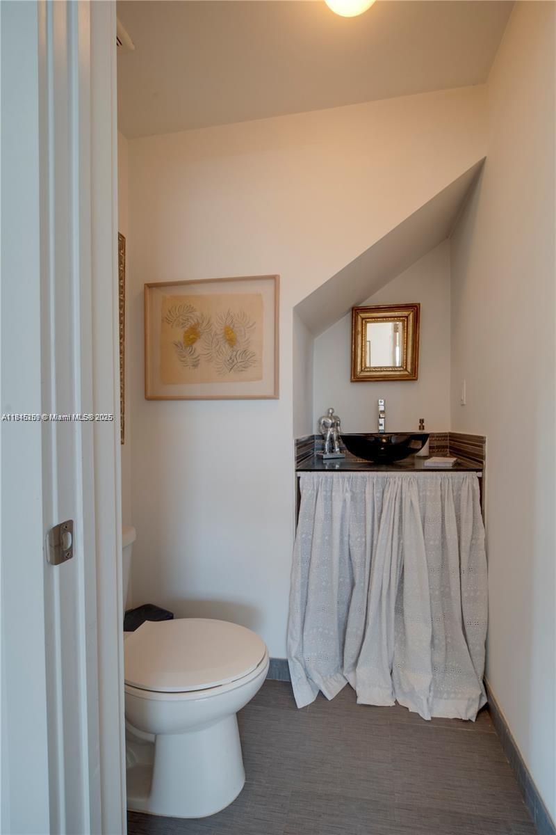 106 Florida Avenue Coral Gables, FL 33133 - Photo 12 of 34 a bathroom with a toilet and a shower