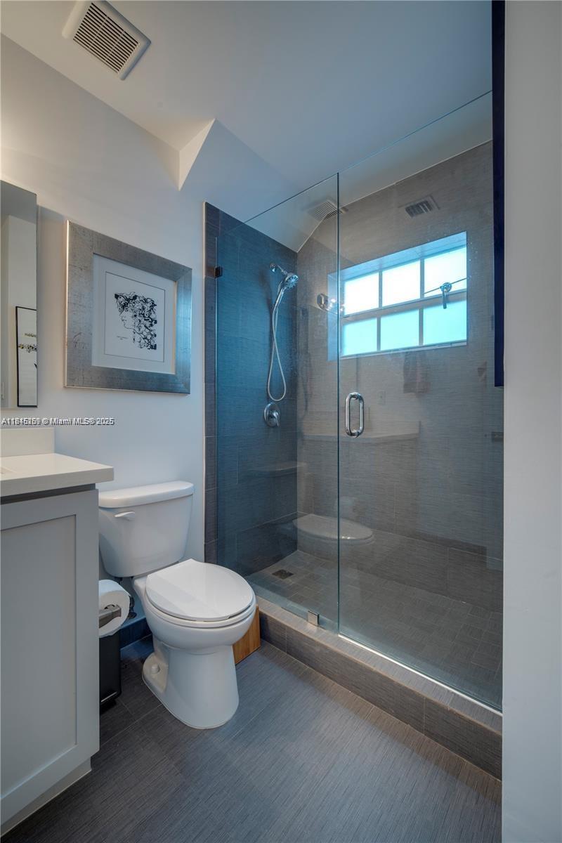106 Florida Avenue Coral Gables, FL 33133 - Photo 15 of 34 a bathroom with a toilet sink and shower