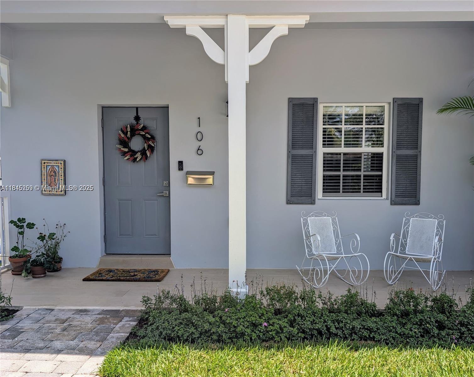 106 Florida Avenue Coral Gables, FL 33133 - Photo 2 of 34 a front view of a house with garden