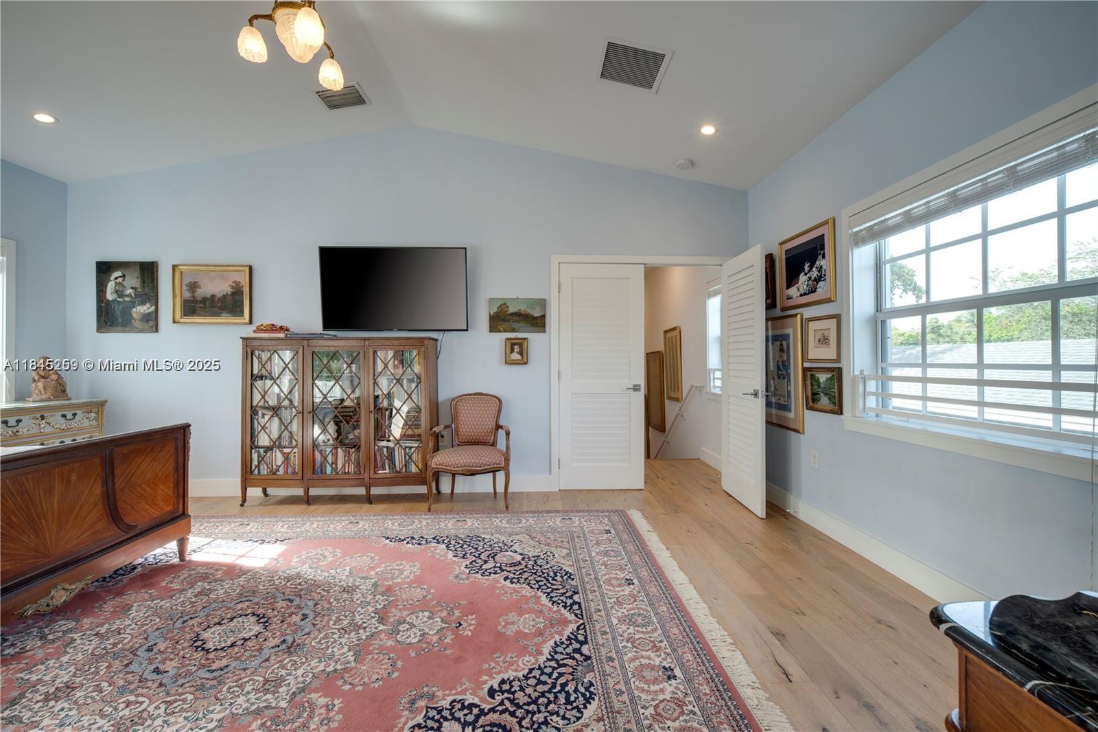 106 Florida Avenue Coral Gables, FL 33133 - Photo 22 of 34 a living room with furniture and a flat screen tv