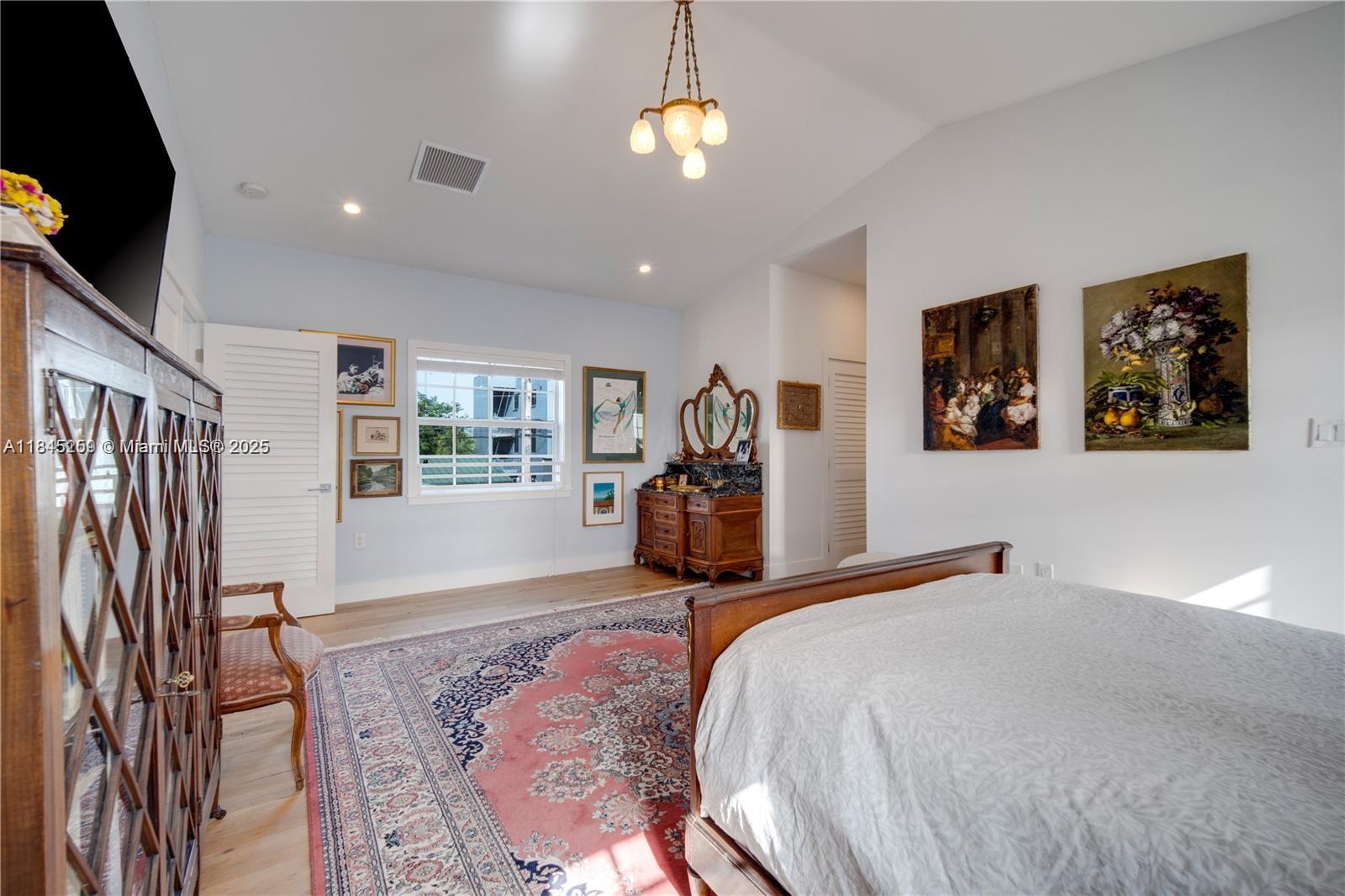 106 Florida Avenue Coral Gables, FL 33133 - Photo 23 of 34 a bedroom with bed and window