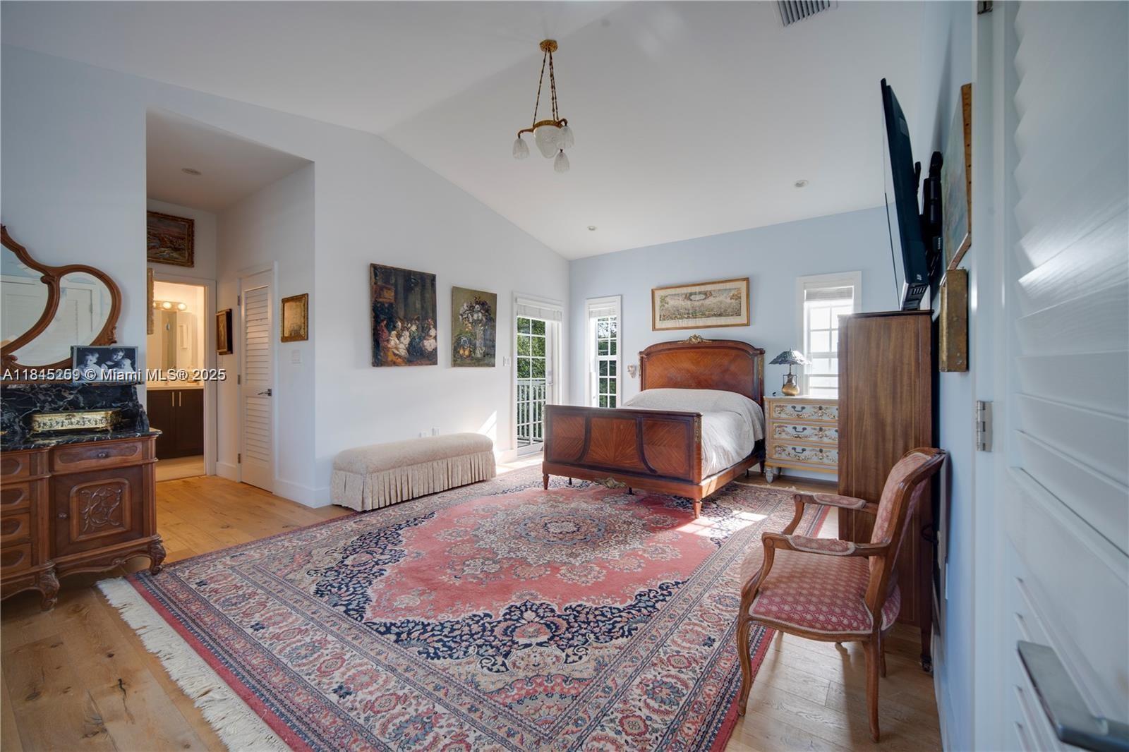 106 Florida Avenue Coral Gables, FL 33133 - Photo 24 of 34 a bedroom with furniture and a wooden floor