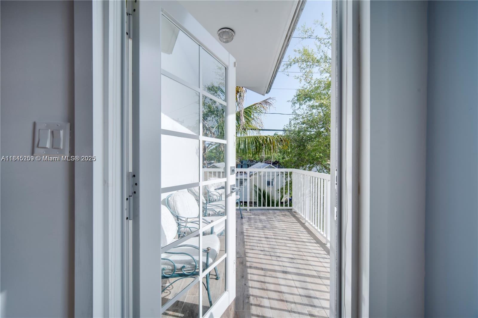 106 Florida Avenue Coral Gables, FL 33133 - Photo 25 of 34 a view of balcony with wooden floor