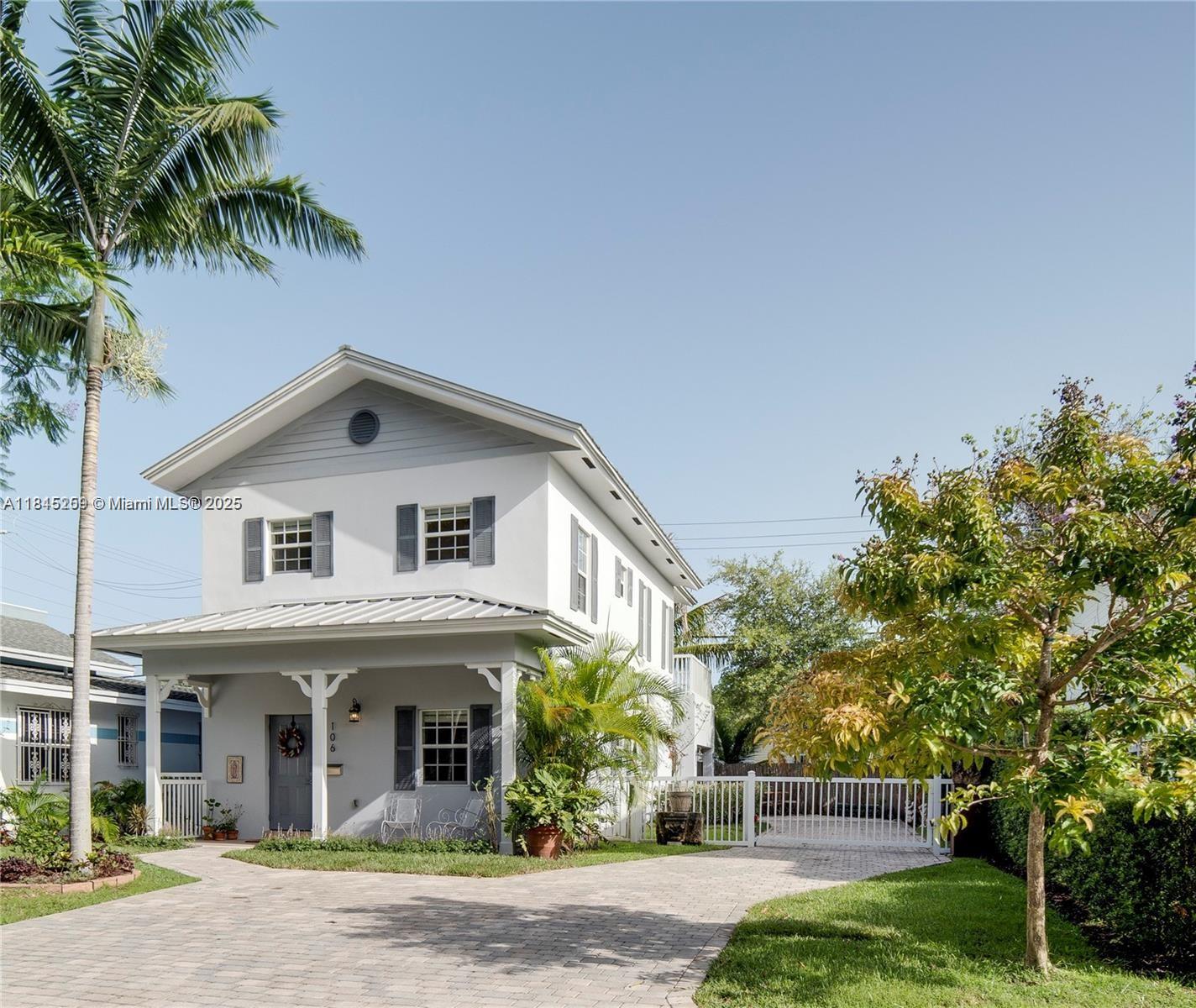 106 Florida Avenue Coral Gables, FL 33133 - Photo 27 of 34 a front view of a house with garden