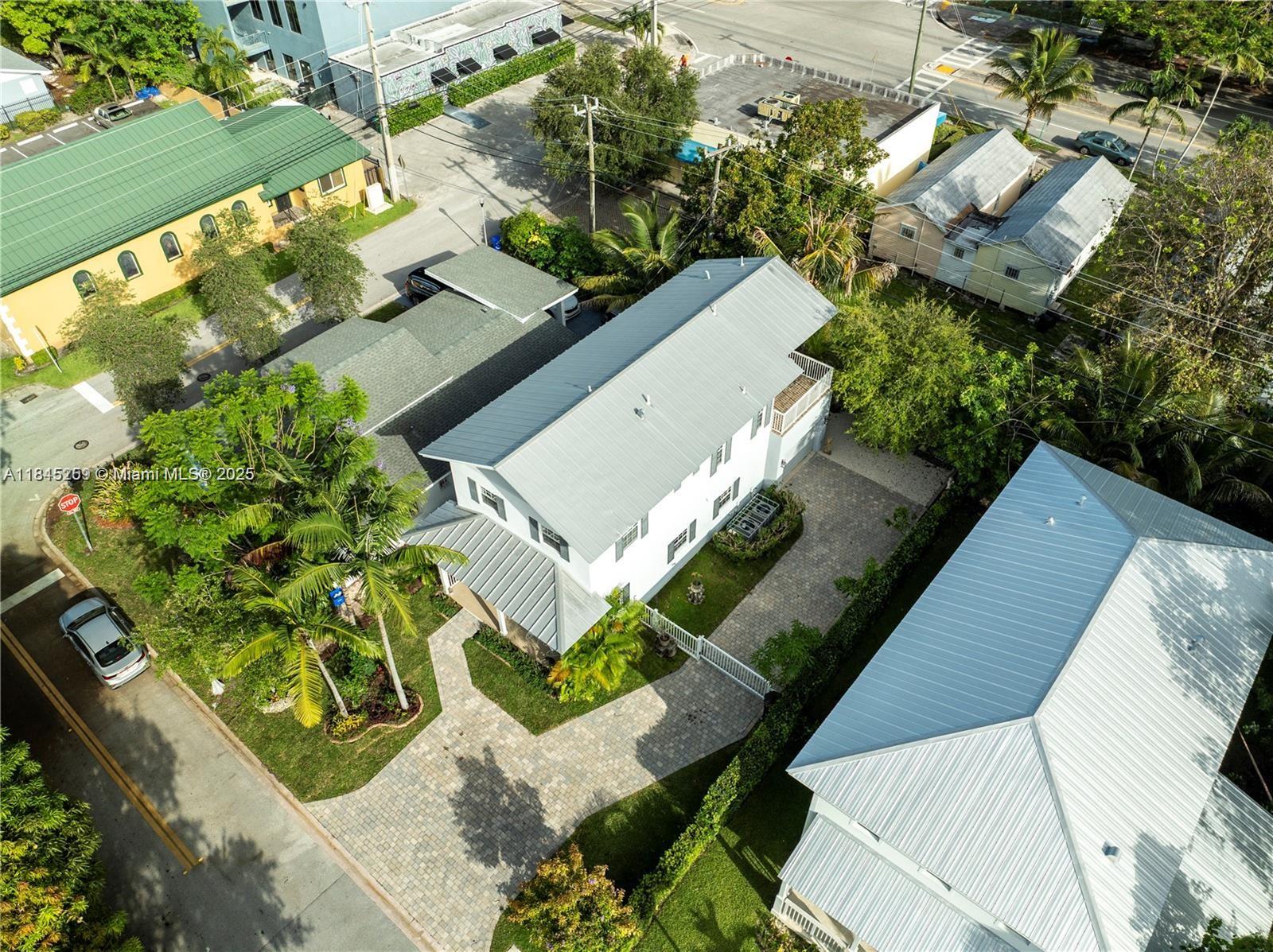 106 Florida Avenue Coral Gables, FL 33133 - Photo 31 of 34 an aerial view of a house with a yard and garden