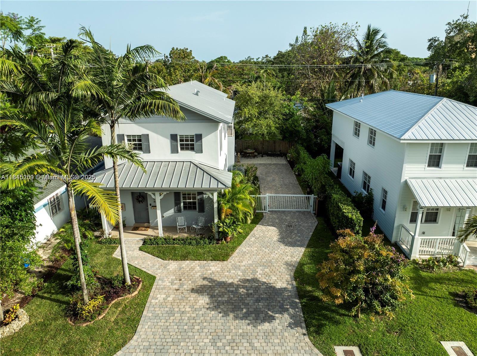 106 Florida Avenue Coral Gables, FL 33133 - Photo 32 of 34 a front view of a house with garden