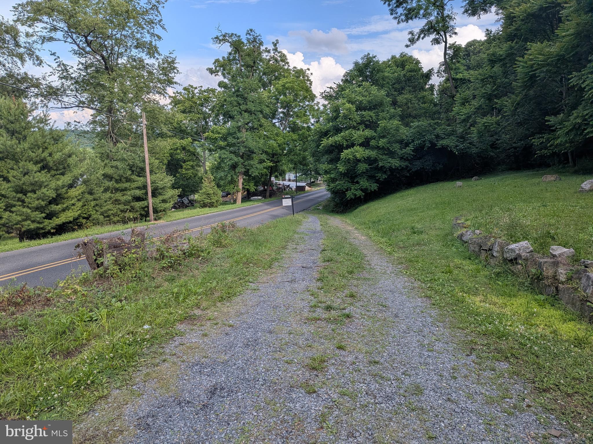 2418 Muddy Run Road Mifflintown, PA 17059 - Photo 15 of 44 a view of a backyard with a garden