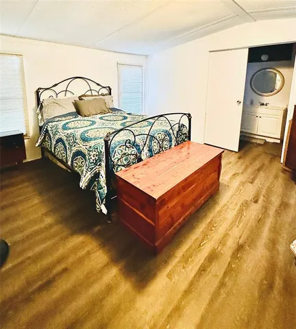 a bedroom with a bed and dresser