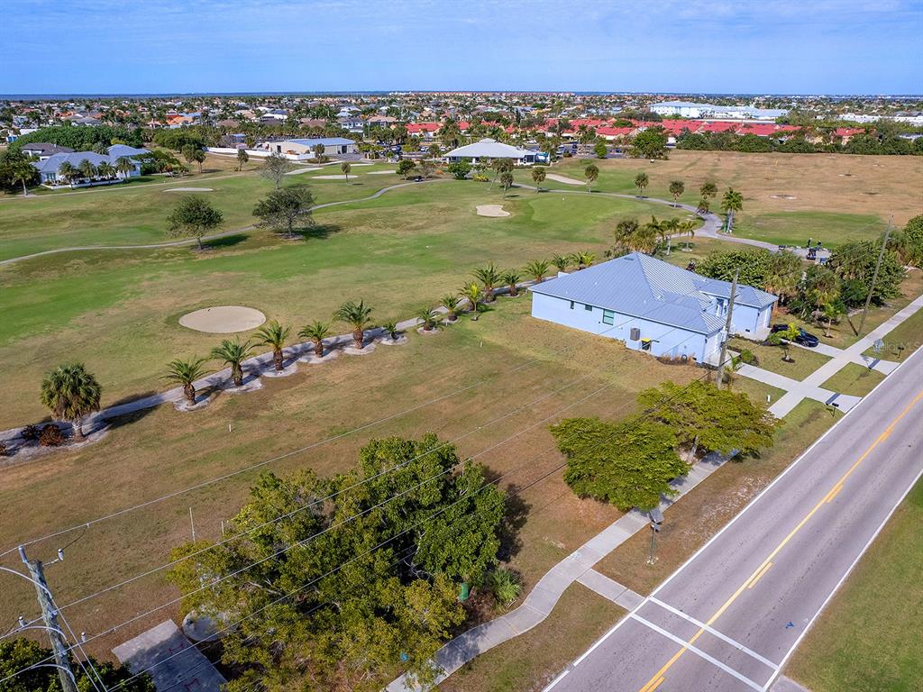 3457 Bal Harbor Boulevard Punta Gorda, FL 33950 - Photo 16 of 27 an aerial view of a houses with a lake view