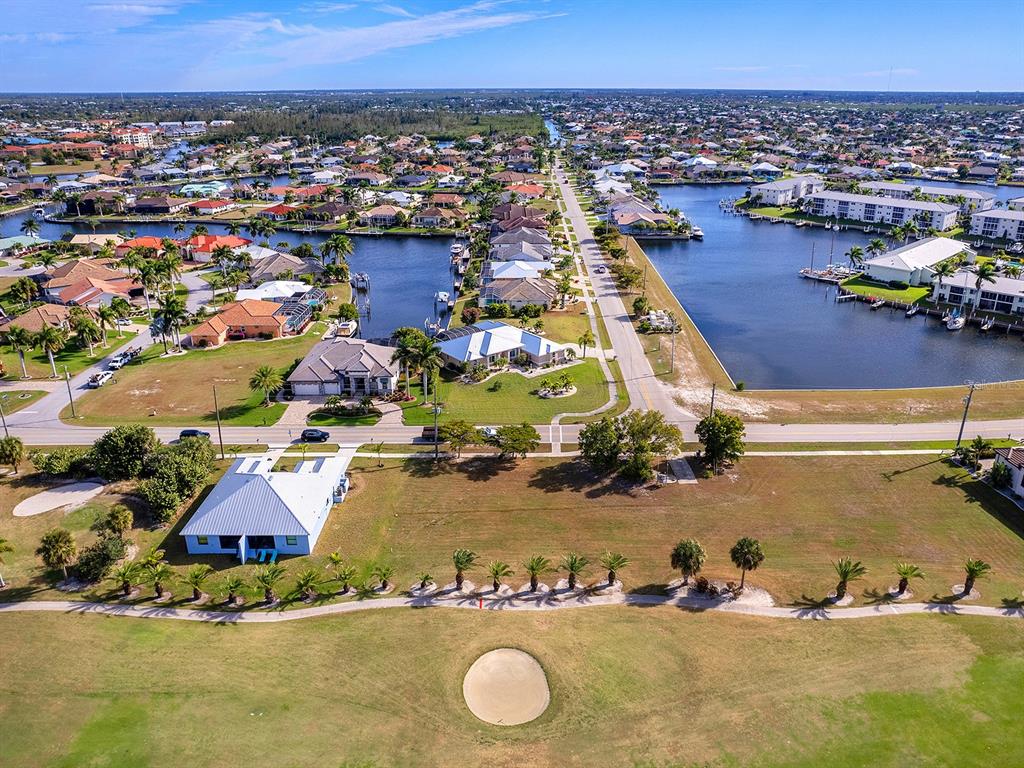 3457 Bal Harbor Boulevard Punta Gorda, FL 33950 - Photo 22 of 27 an aerial view of a house with a swimming pool yard and outdoor seating