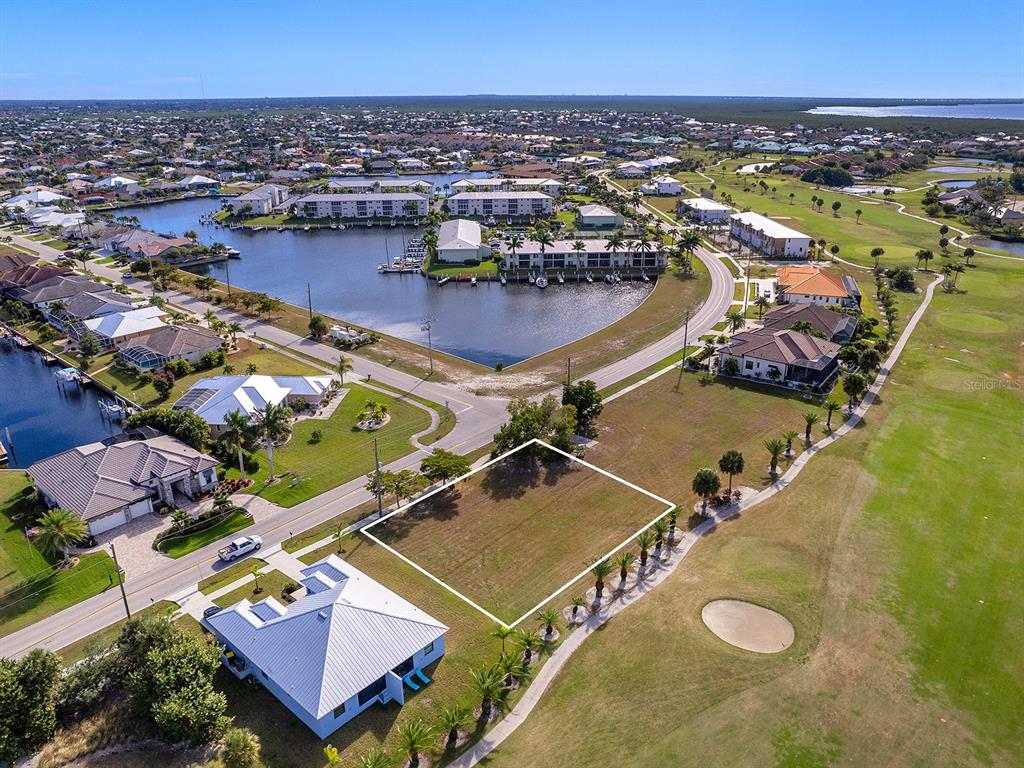 3457 Bal Harbor Boulevard Punta Gorda, FL 33950 - Photo 3 of 27 an aerial view of a tennis ground and a city view