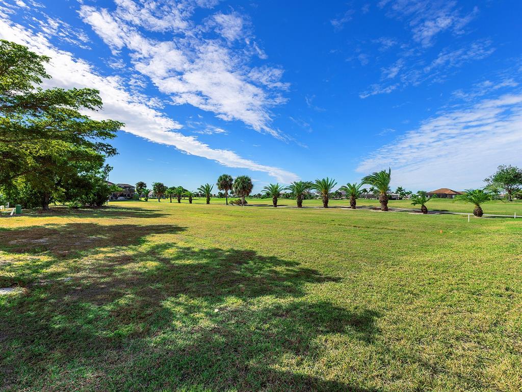 3457 Bal Harbor Boulevard Punta Gorda, FL 33950 - Photo 7 of 27 a view of a field with big tree
