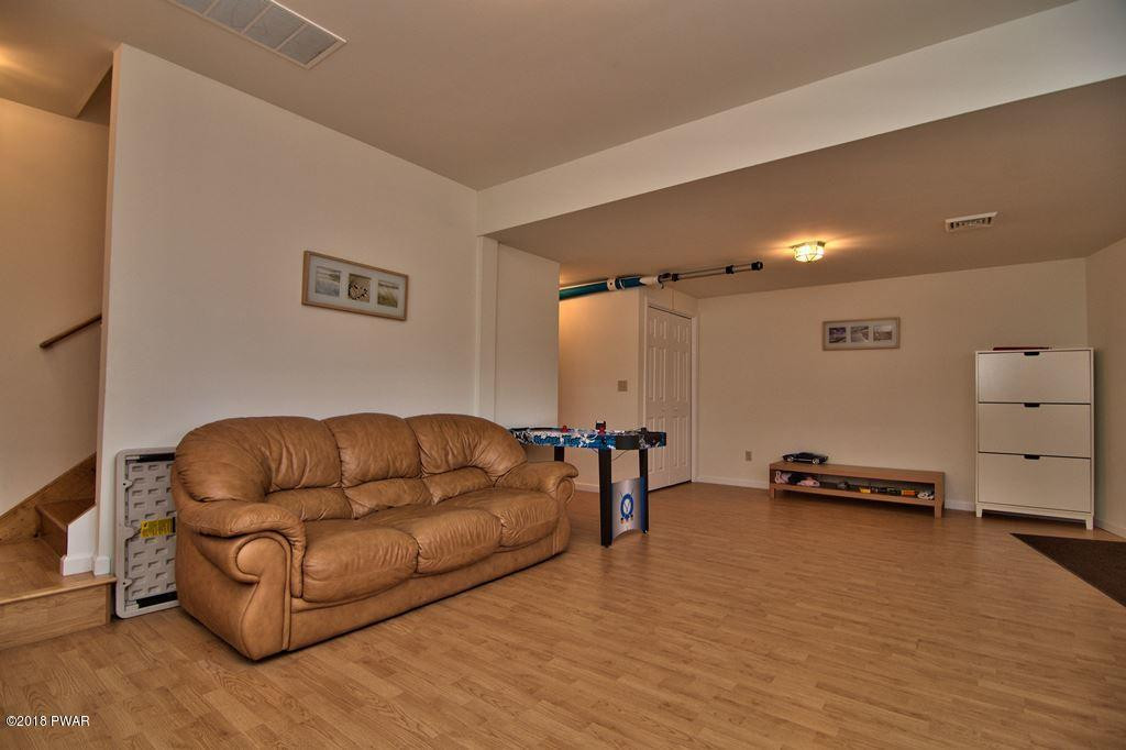 2312 Brookfield Road Lake Ariel, PA 18436 - Photo 19 of 26 a living room with furniture and a wooden floor