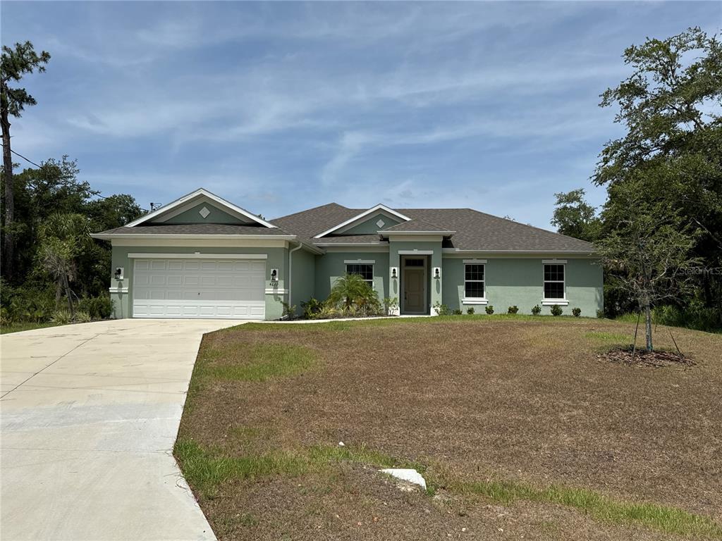 4619 Chamrade Road North Port, FL 34288 - Photo 1 of 1 a front view of a house with a garden