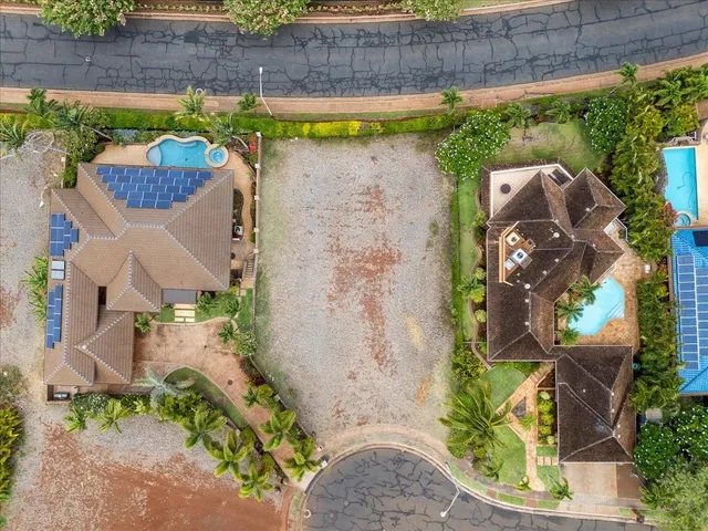 an aerial view of a house with a swimming pool