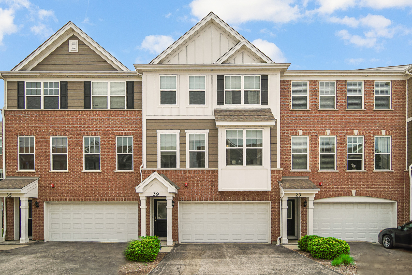 29 Grey Wolf Drive Wheeling, IL 60090 - Photo 1 of 30 a front view of a residential apartment building with a yard