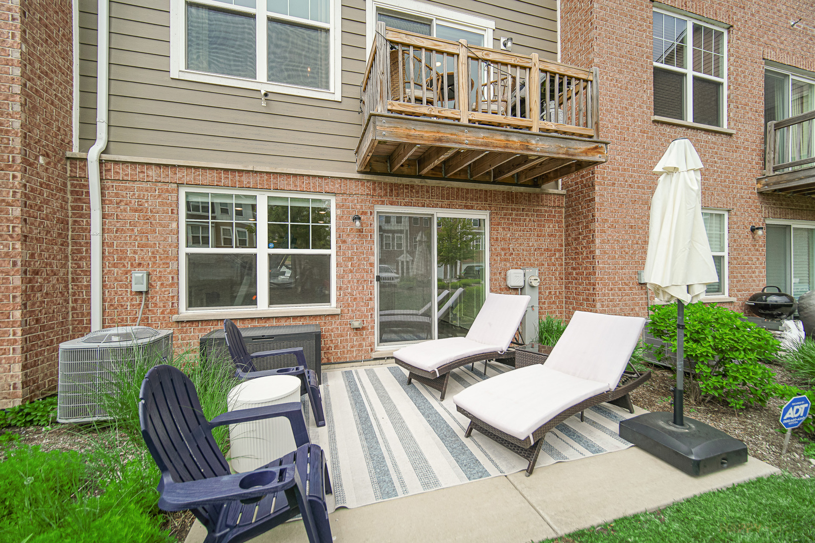 29 Grey Wolf Drive Wheeling, IL 60090 - Photo 24 of 30 a view of a patio with couple of chairs and a yard