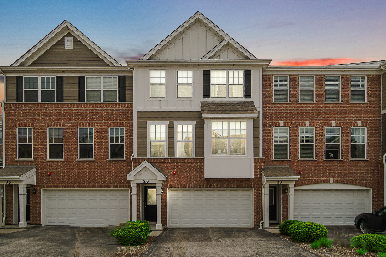 29 Grey Wolf Drive Wheeling, IL 60090 - Photo 30 of 30 a front view of a residential apartment building with a yard