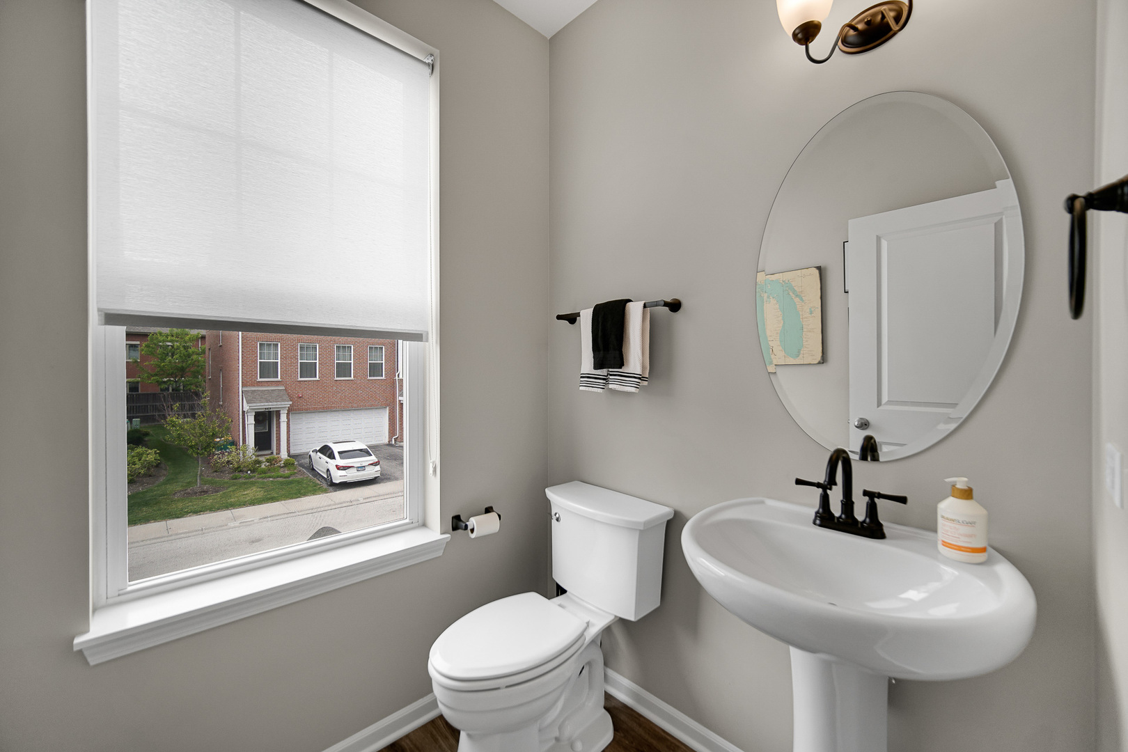 29 Grey Wolf Drive Wheeling, IL 60090 - Photo 10 of 30 a bathroom with a toilet a sink and mirror