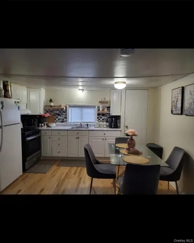 a kitchen with a sink cabinets and stainless steel appliances