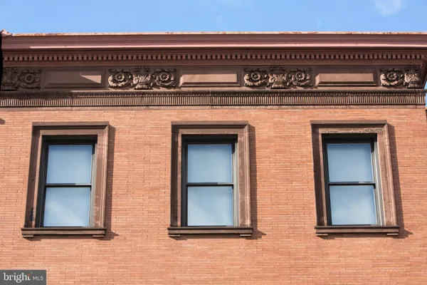 a kitchen with stainless steel appliances granite countertop a stove a sink a microwave a refrigerator and cabinets