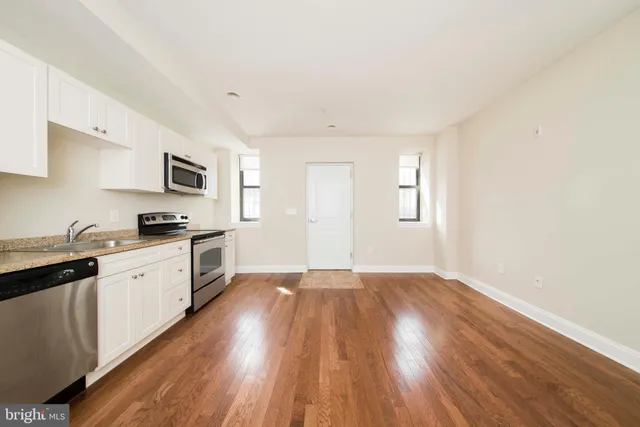 a bathroom with a toilet and a bathtub